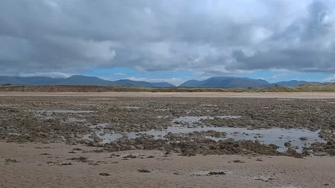 Beach with mountain range view Stockbeeldmateriaal 202068379