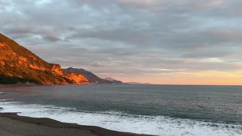 Beach with mountain, sunset over ocean, natural landscape, dusk horizon Stock Footage 266686430