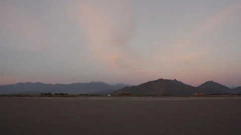 Beach with mountains and a flock on the background Stock Footage 285167098