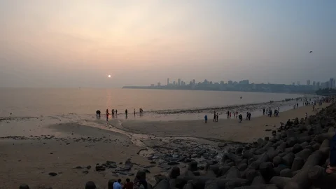 Beach in Mumbai, India, at sunset. Stock Footage 129076570
