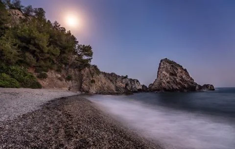 A beach at night with the moonlight Stock Photos
