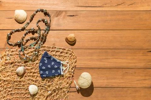 Beach objects and face mask on wooden boards. Stock Photos