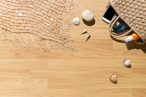 Beach objects on parquet flooring. Stock Photos
