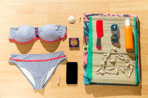 Beach objects on parquet flooring. Stock-Fotos
