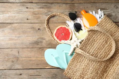 Beach objects on wooden background, flat lay Stock Photos