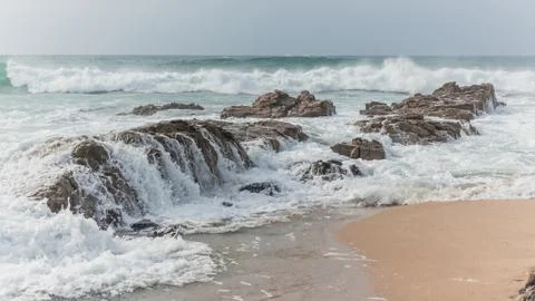Beach  Ocean Waves Winds Rocky Coastline Stock Photos