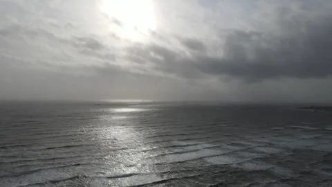 Beach with offshore windfrm in distance Stock Footage 336992140