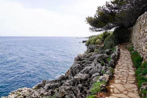 Beach paca paved pathway of mediterranean sea in south Antibes Juan-les-Pins  Stock Photos