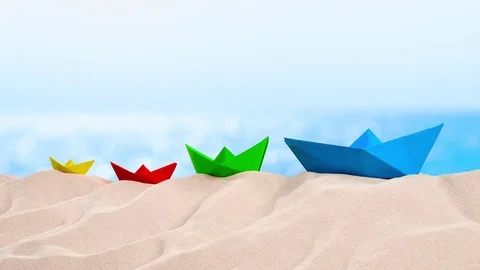 On the Beach - Paper boats on a dune in front of azure sea - loop - ProRes Stock-Footage 77610042