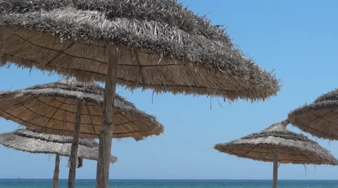 Beach parasol moves in the wind  07 Stock Footage 58923174