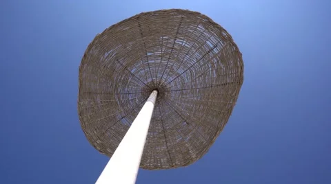 Beach parasol moves in the wind 스톡 동영상 67203221