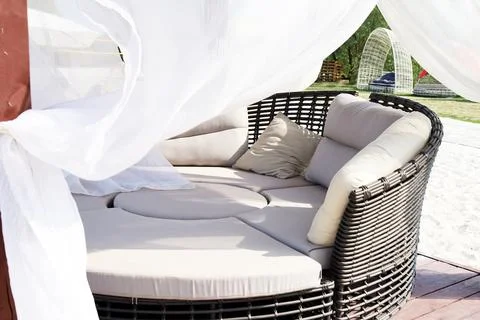 Beach party area with soft sofas and curtains Stock Photos