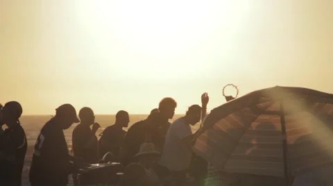 Beach party at sunset Stock Footage 56343213