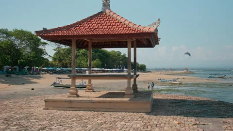 Beach pavilion and kite surfer , Karang Beach, Bali Video stock 336514741