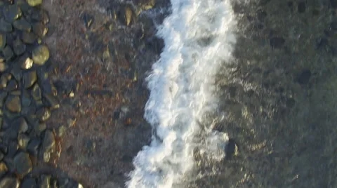 Beach with pebble stone with camera pan 動画素材 65186239