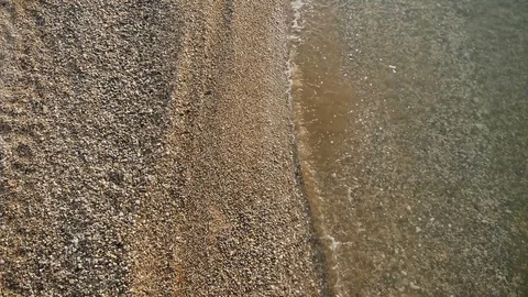 Beach with pebble wave washes the shore Stock Footage 117844984