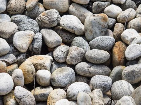 Beach pebbles background Stock Photos