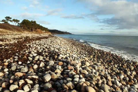 Beach pebbles coast Stock Photos