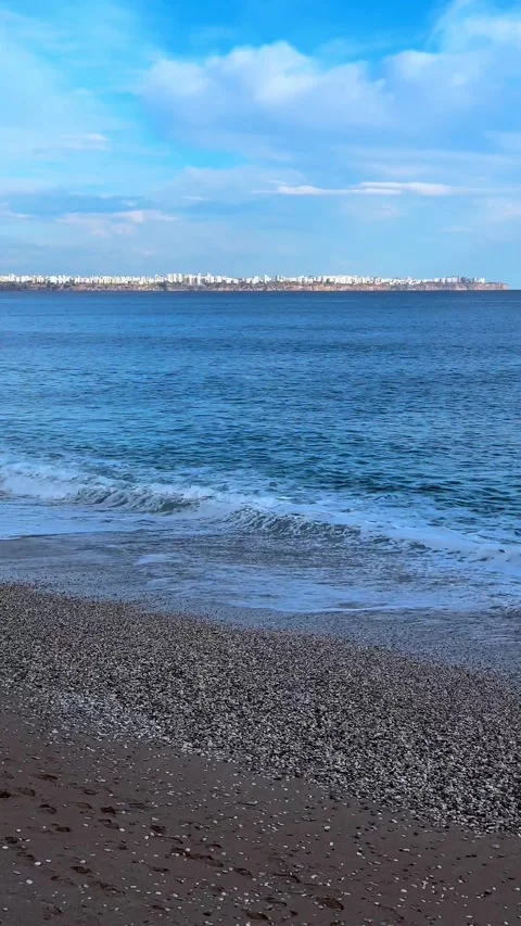 Beach pebbles small waves cloud sunset 動画素材 274052508