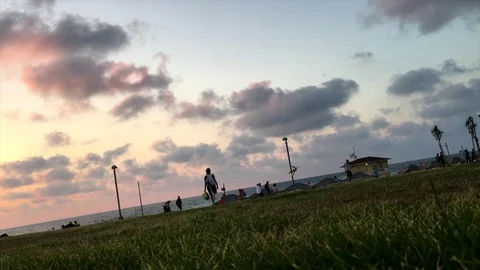 Beach people background cyclist Stock Footage 98676949