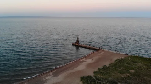 Beach Pier at Sunset in Summer Stock Footage 129763979