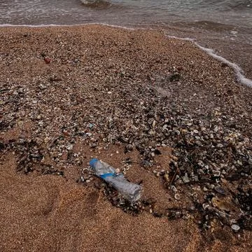 Beach polluted with plastic waste.environmental problems of humanity Фото