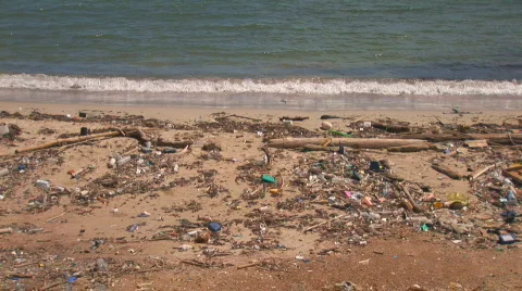 Beach with pollution - wide tilt up Stock Footage