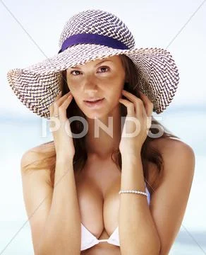 Beach portrait of young woman wearing white bikini Stock Photos