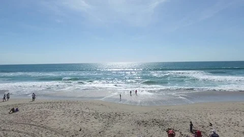 Beach push past life guard tower to over waves Video stock 76138057