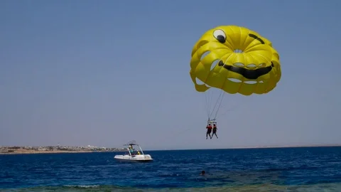 Beach recteations with parachute Stock Footage 76025663
