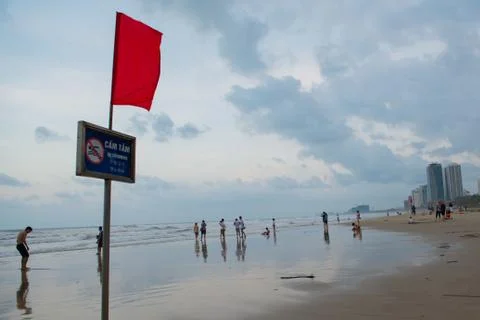 Beach with red flag Stockfoto's