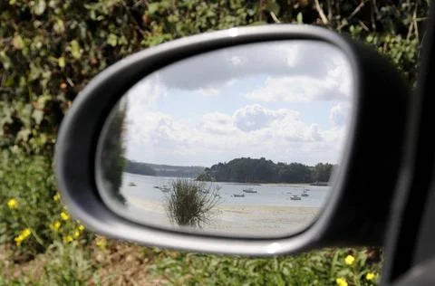 Beach reflected in side mirror Side mirror of car reflecting beautiful bea... Stock Photos