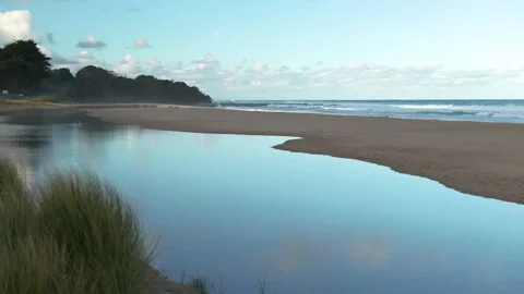Beach with reflections off water Stock Footage 274345246