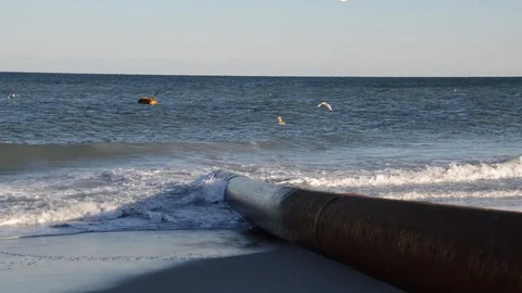 Beach Replenishment Pipe and Breaking Waves Stock Footage 102629838