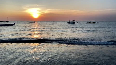 Beach resort during sunset late afternoon or early evening with some boats Stock Footage 241140991