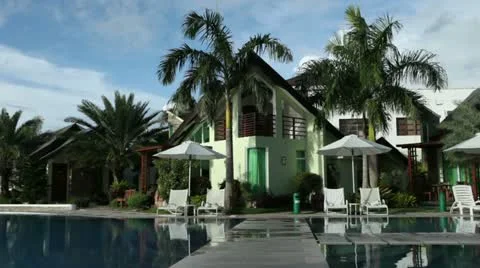 Beach Resort with palm trees by the pool. Stock-Footage 10821375
