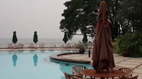 Beach resort poolside on a cloudy day Stock Footage 47887124