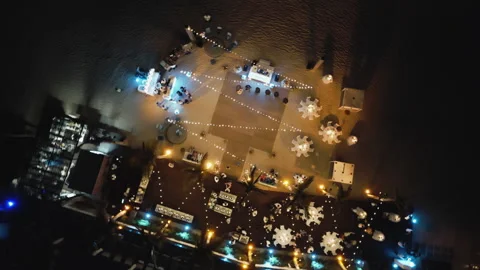 Beach restaurant at night in Los Cabos, Mexico aerial view Stock Footage 244848863