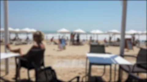 Beach restaurant where everything is out of focus Stock Footage 122360445