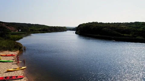 Beach River Delta FPV Lower Fly Along River Canoes Sports Hot Dry Sunny Day Stock Footage 235665061