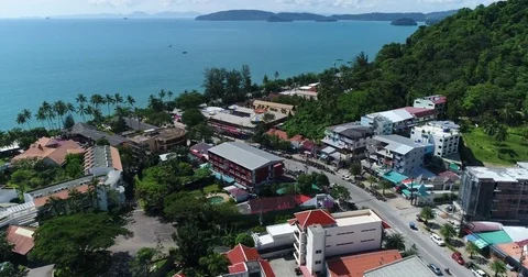 Beach road and hotel frontage looking out to distant islands Vídeos de archivo 71302250