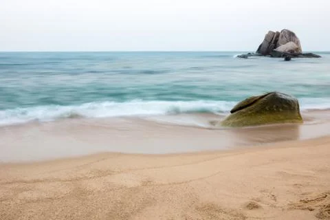 Beach with rock Stock Photos