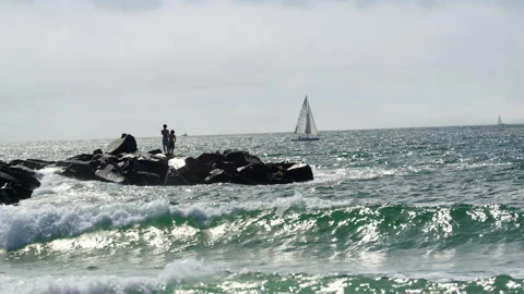Beach rock pier and waves Video stock 236534741