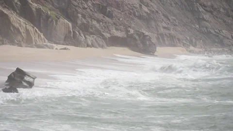 Beach rock waves during storm Stock Footage 75654525