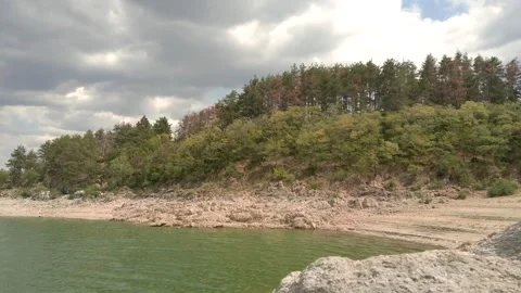 Beach with rocks and forest Stock Footage 136505894