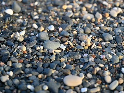 Beach with rocks and pebbles 스톡 사진