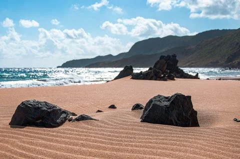 Beach with Rocks and Sand Stock Photos