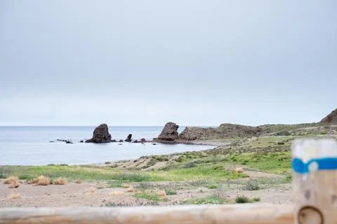 Beach with rocks in the background 스톡 사진