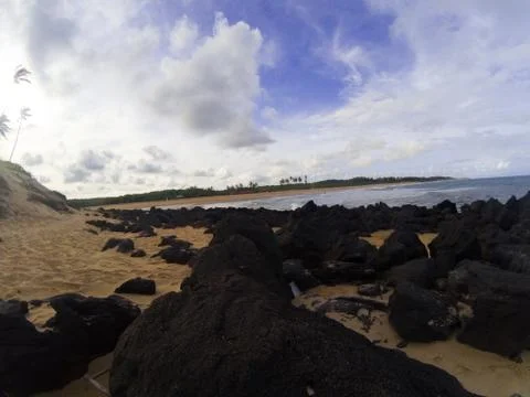 Beach with rocks Stock Photos