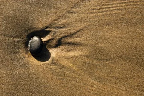 Beach rocks in the sand Stock Photos